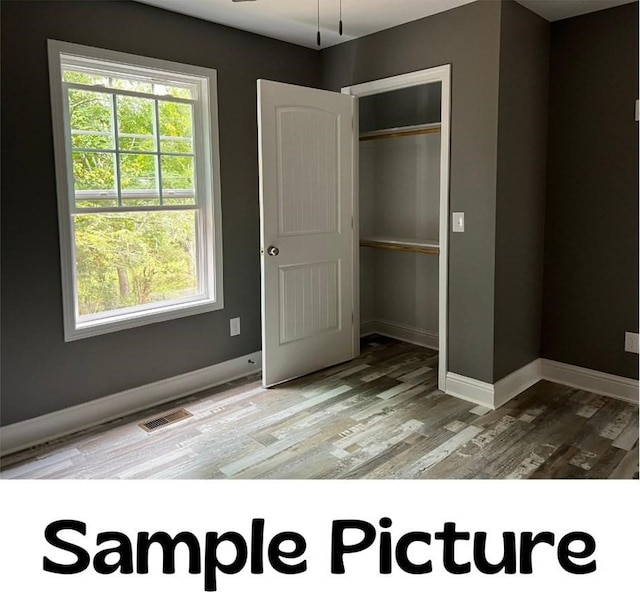 LOT4 River Bend Rd, Dalton, GA 30721 - unfurnished bedroom featuring wood finished floors, baseboards, and a closet