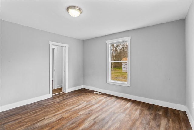 empty room featuring hardwood / wood-style floors