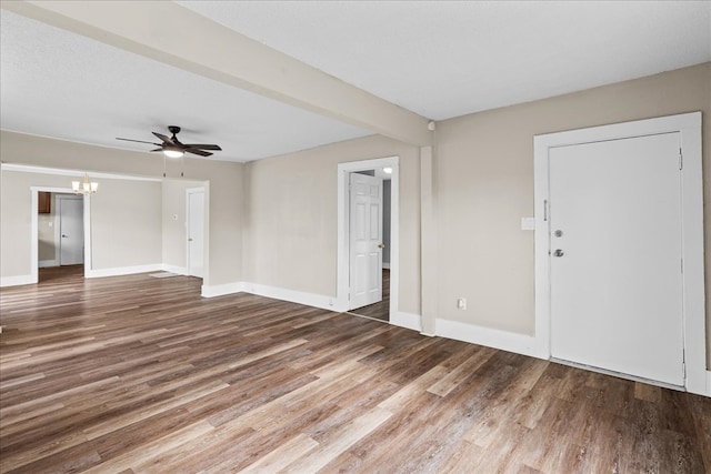 entryway with hardwood / wood-style flooring, ceiling fan with notable chandelier, a textured ceiling, and beamed ceiling