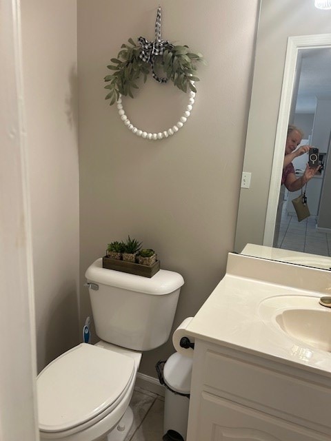 1699 Pin Oak Dr Unit 133, Dalton, GA 30721 - half bath with toilet, vanity, tile patterned floors, and baseboards
