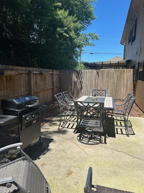 1699 Pin Oak Dr Unit 133, Dalton, GA 30721 - fenced backyard with outdoor dining area, a patio, and grilling area