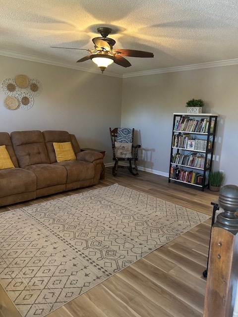 1699 Pin Oak Dr Unit 133, Dalton, GA 30721 - living room with wood finished floors, a ceiling fan, crown molding, a textured ceiling, and baseboards