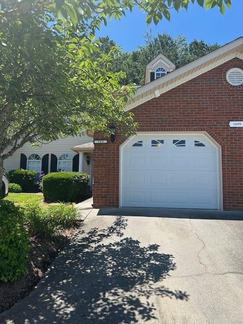 1699 Pin Oak Dr Unit 133, Dalton, GA 30721 - view of front of property with brick siding, an attached garage, and concrete driveway