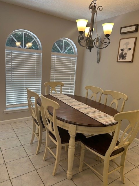 1699 Pin Oak Dr Unit 133, Dalton, GA 30721 - dining space featuring healthy amount of natural light, a chandelier, light tile patterned floors, and a textured ceiling