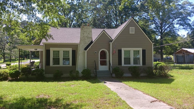 430 Lester Ave, Dalton, GA 30721 - view of front of house with a chimney and a front lawn