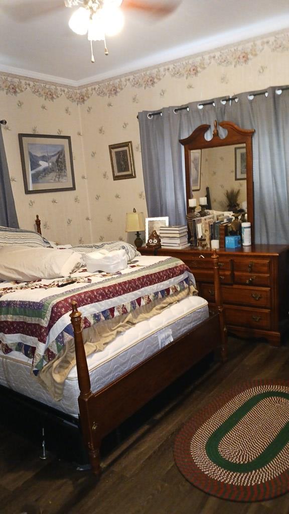 430 Lester Ave, Dalton, GA 30721 - bedroom featuring wood finished floors, wallpapered walls, and a ceiling fan