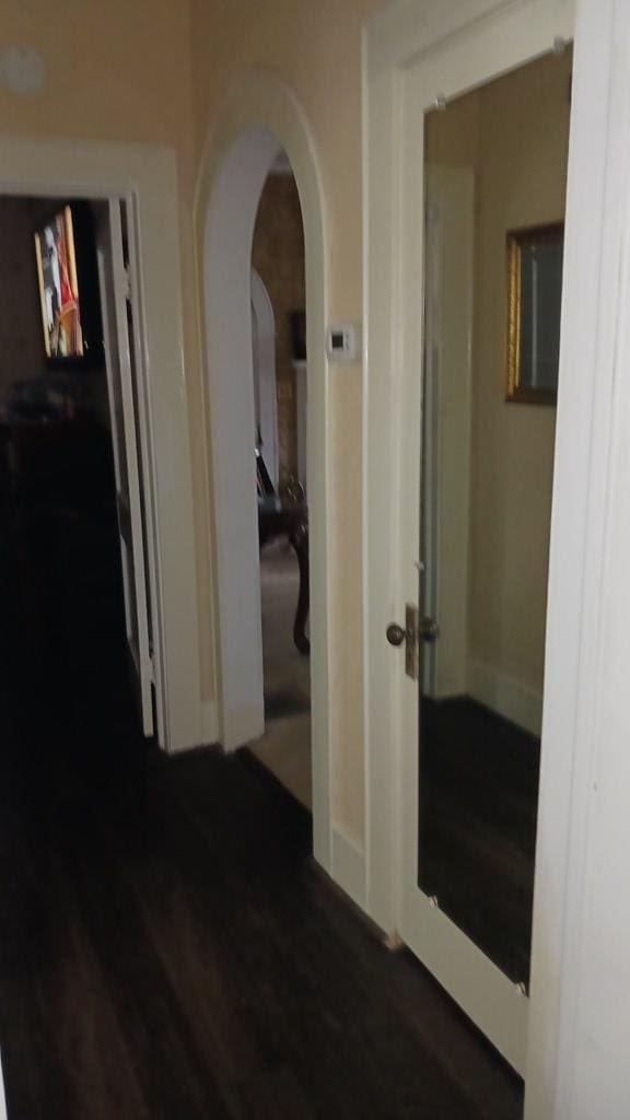 430 Lester Ave, Dalton, GA 30721 - corridor featuring arched walkways and dark wood-style floors