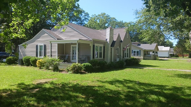 430 Lester Ave, Dalton, GA 30721 - ranch-style home featuring a front yard, a chimney, and a porch