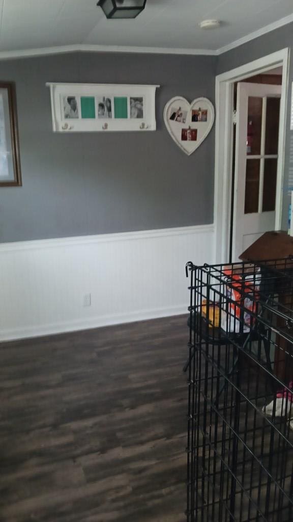 430 Lester Ave, Dalton, GA 30721 - dining area with crown molding, dark wood-type flooring, and a wainscoted wall