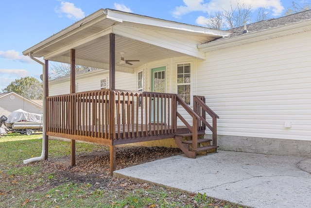 deck with ceiling fan and a patio area