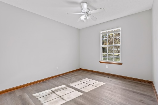 empty room featuring light hardwood / wood-style floors and ceiling fan