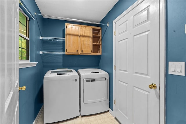 493 Lennox Way, Rocky Face, GA 30740 - washroom featuring cabinet space, baseboards, light floors, and washer and clothes dryer