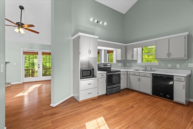 493 Lennox Way, Rocky Face, GA 30740 - kitchen featuring light countertops, a sink, appliances with stainless steel finishes, high vaulted ceiling, and ceiling fan