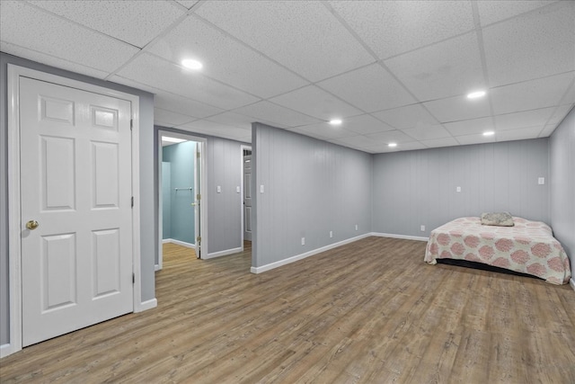 493 Lennox Way, Rocky Face, GA 30740 - unfurnished bedroom with baseboards, wood finished floors, a drop ceiling, and recessed lighting
