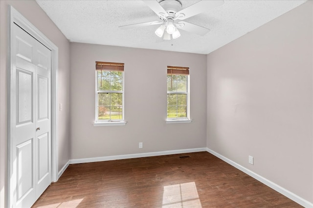 493 Lennox Way, Rocky Face, GA 30740 - unfurnished bedroom featuring baseboards, wood finished floors, a textured ceiling, and a closet
