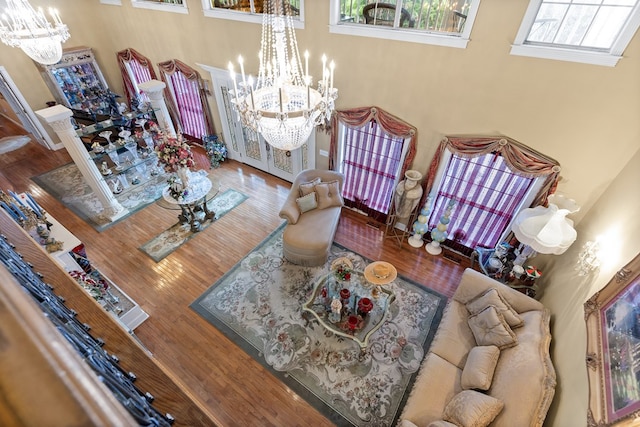 living room featuring hardwood / wood-style flooring and a chandelier