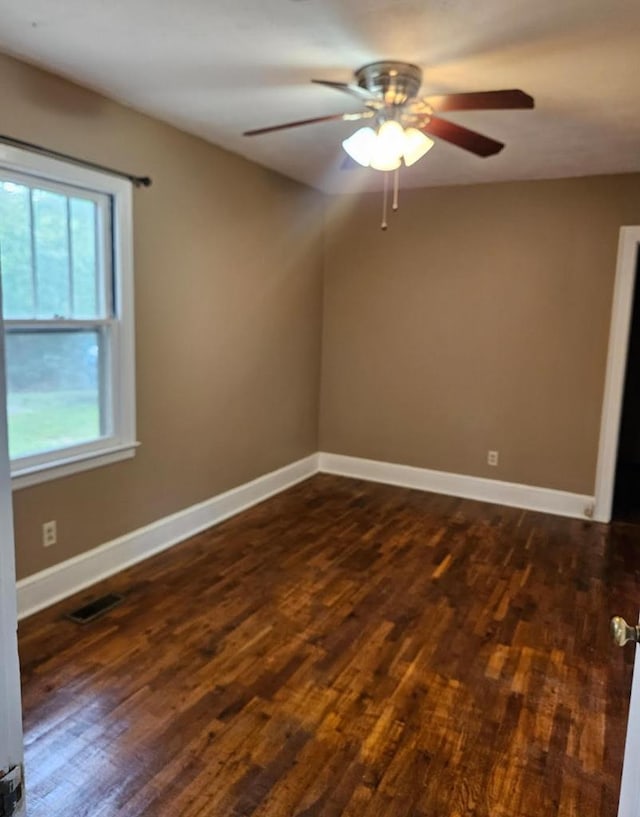 3165 Mcdaniel Station Rd, Adairsville, GA 30103 - spare room with dark wood-style flooring, ceiling fan, and baseboards
