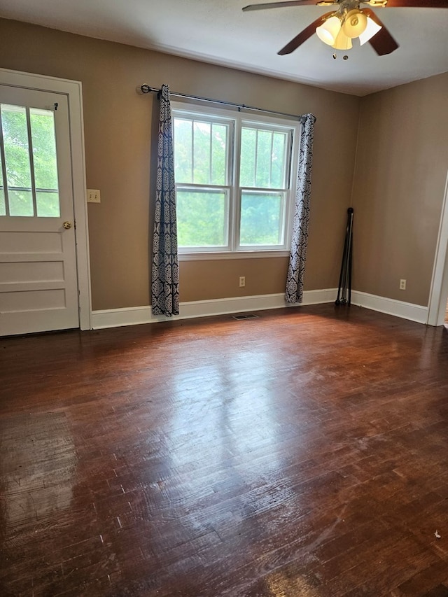 3165 Mcdaniel Station Rd, Adairsville, GA 30103 - spare room featuring healthy amount of natural light, a ceiling fan, dark wood-style floors, and baseboards