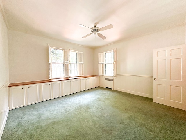 705 Greenwood Dr, Dalton, GA 30720 - carpeted spare room featuring radiator, a wainscoted wall, and a ceiling fan
