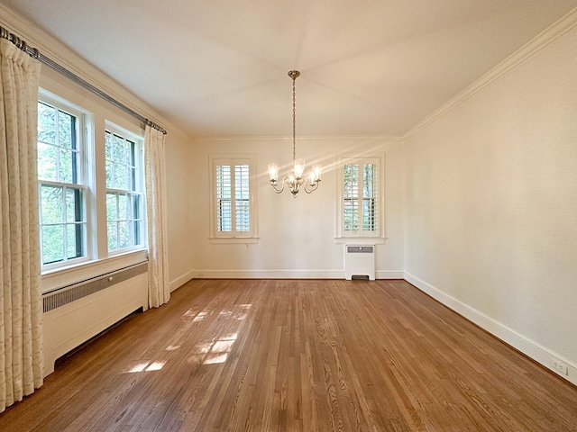 705 Greenwood Dr, Dalton, GA 30720 - unfurnished dining area featuring baseboards, an inviting chandelier, ornamental molding, and wood finished floors