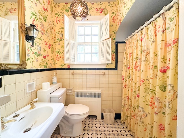 705 Greenwood Dr, Dalton, GA 30720 - full bath featuring radiator heating unit, tile walls, wallpapered walls, and a sink