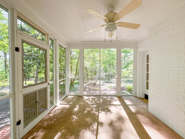 705 Greenwood Dr, Dalton, GA 30720 - unfurnished sunroom with brick wall and wood ceiling