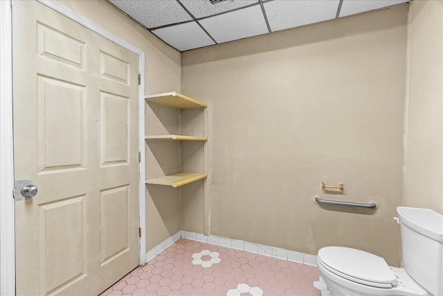 843 Mcafee St, Dalton, GA 30721 - bathroom featuring tile patterned flooring, toilet, baseboards, and a drop ceiling