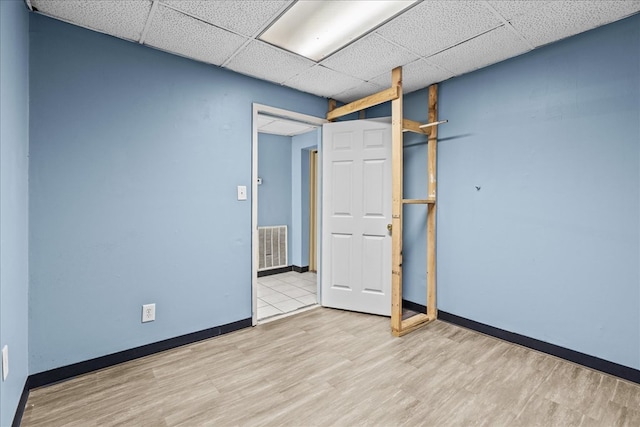843 Mcafee St, Dalton, GA 30721 - interior space featuring baseboards, visible vents, wood finished floors, and a drop ceiling