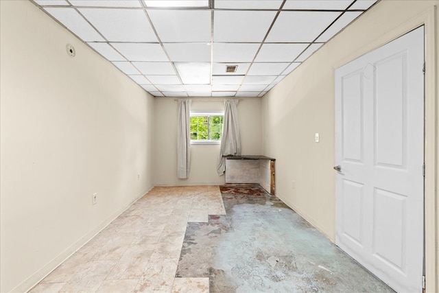 843 Mcafee St, Dalton, GA 30721 - unfurnished living room featuring baseboards and a drop ceiling
