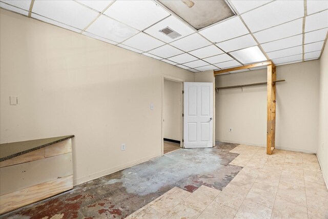 843 Mcafee St, Dalton, GA 30721 - unfurnished bedroom with baseboards, a paneled ceiling, and visible vents