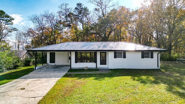 single story home with a carport and a front lawn