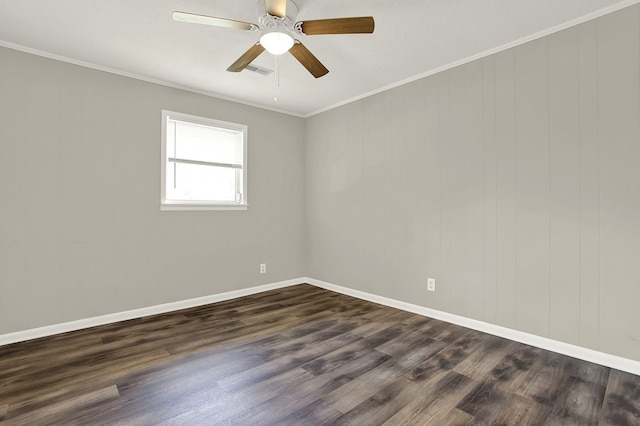 spare room with dark wood-type flooring, ceiling fan, and ornamental molding