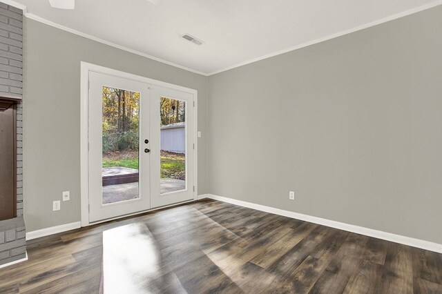 doorway featuring crown molding, dark hardwood / wood-style flooring, and french doors