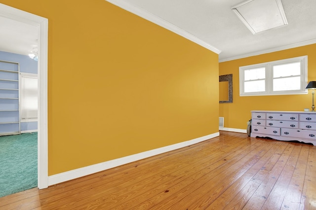 interior space with crown molding and hardwood / wood-style floors