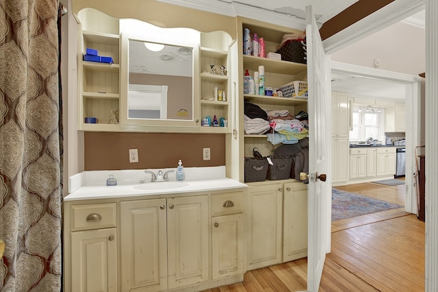 interior space with vanity and hardwood / wood-style floors