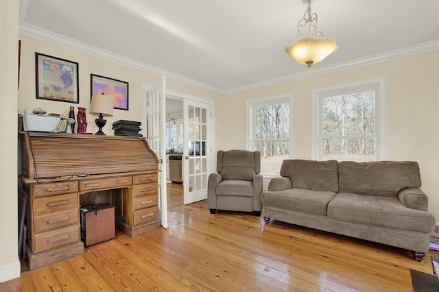 living room featuring french doors, ornamental molding, and light hardwood / wood-style floors