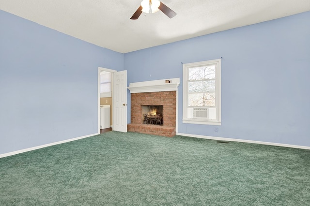 unfurnished living room with ceiling fan, cooling unit, carpet floors, a textured ceiling, and a brick fireplace