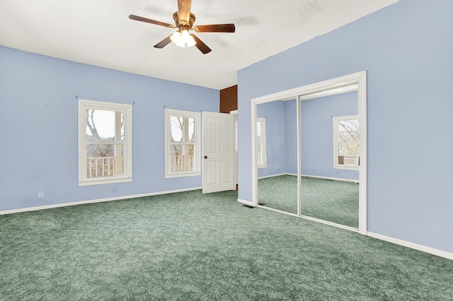 unfurnished bedroom featuring carpet floors, ceiling fan, and a closet