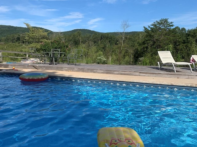 view of pool with a mountain view