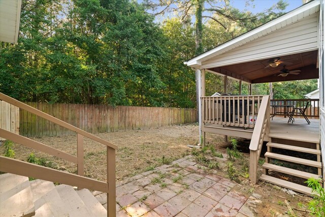 353 Diamond Way, Chatsworth, GA 30705 - fenced backyard featuring a wooden deck, a patio, and a ceiling fan