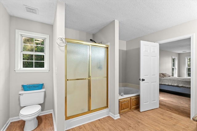 353 Diamond Way, Chatsworth, GA 30705 - full bath featuring wood finished floors, connected bathroom, a stall shower, a bath, and a textured ceiling