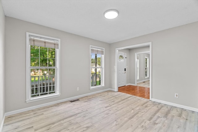353 Diamond Way, Chatsworth, GA 30705 - empty room with healthy amount of natural light and wood finished floors