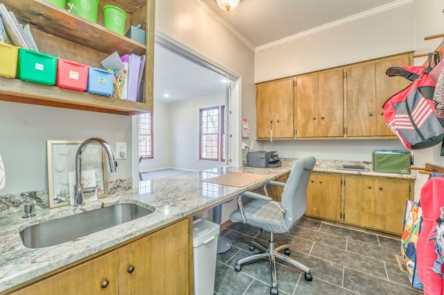 tiled office with crown molding, built in desk, and sink