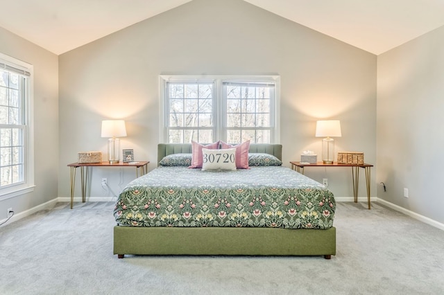 bedroom featuring lofted ceiling and carpet flooring