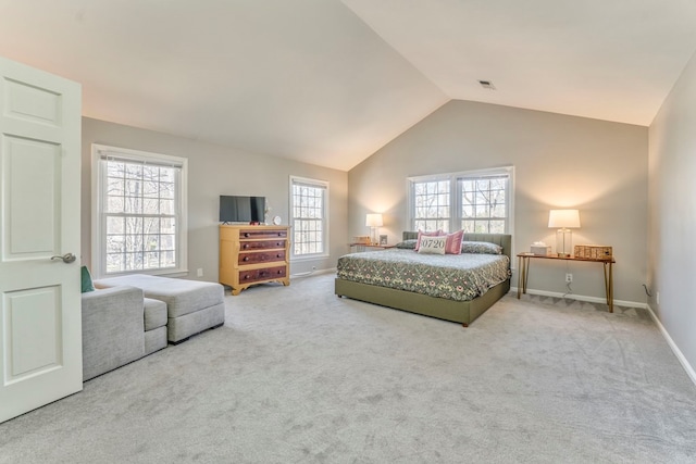 bedroom with vaulted ceiling and carpet flooring