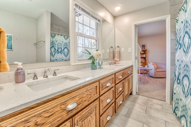 bathroom featuring tile patterned floors and vanity