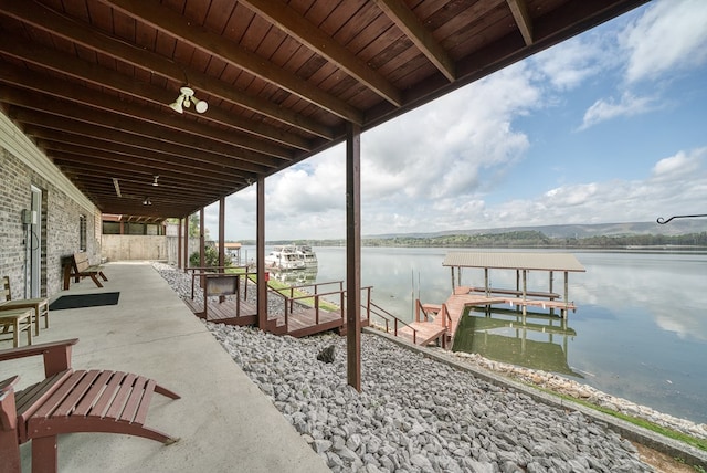 view of dock featuring a water view and boat lift