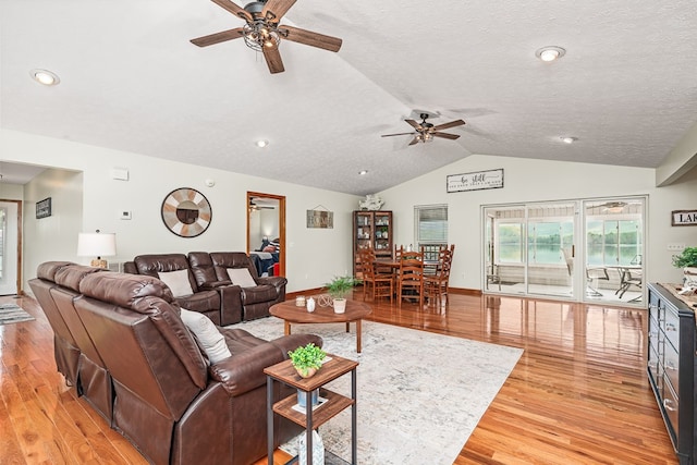 living room featuring recessed lighting, light wood finished floors, vaulted ceiling, baseboards, and ceiling fan