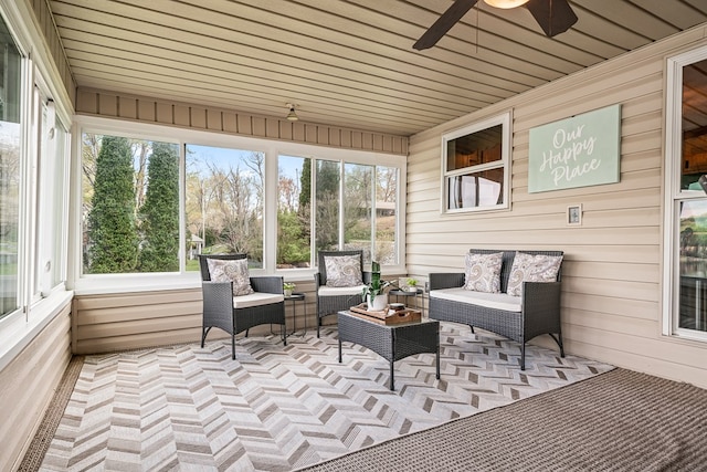 sunroom / solarium with an outdoor living space and ceiling fan