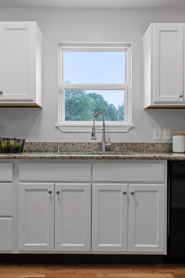 5742 Keith Rd, Ringgold, GA 30736 - kitchen featuring light stone countertops, black dishwasher, and white cabinetry
